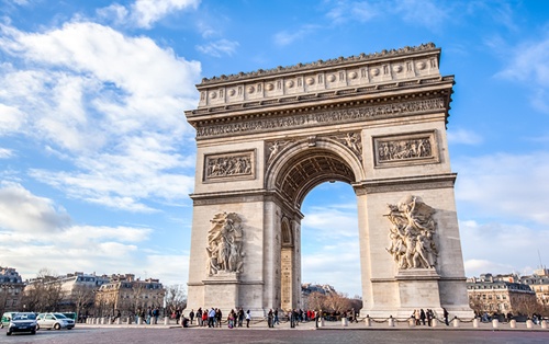 France's Arc de Triomphe is pictured against a blue sky.