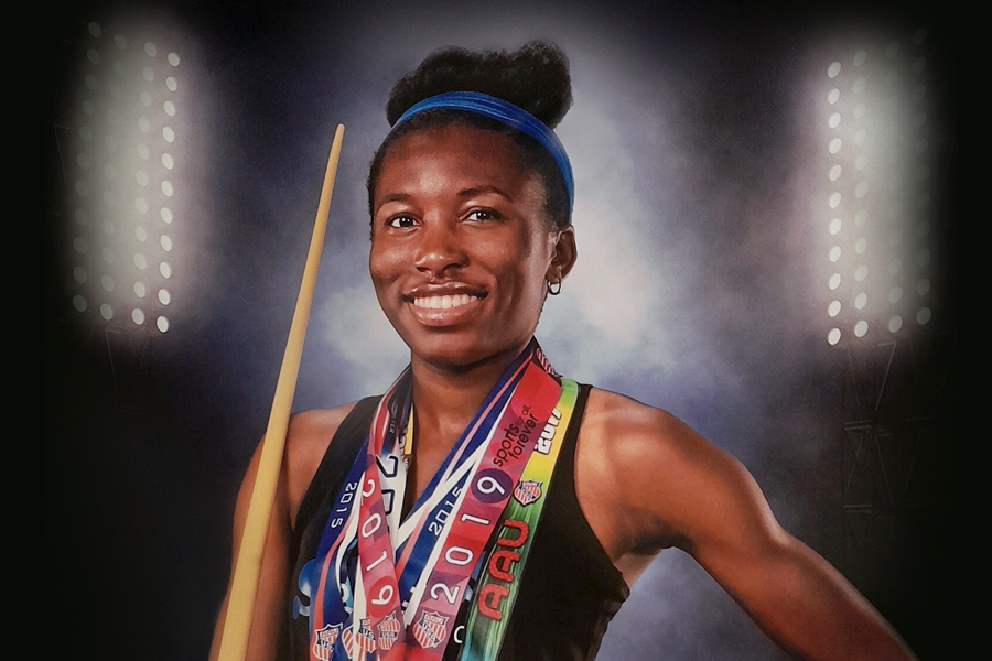 Image of Jordan Norwood wearing her track and field medals